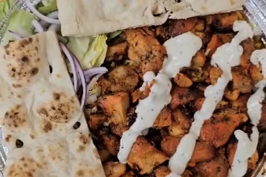 Delhi Garden's New York-style chicken platter with naan and white sauce